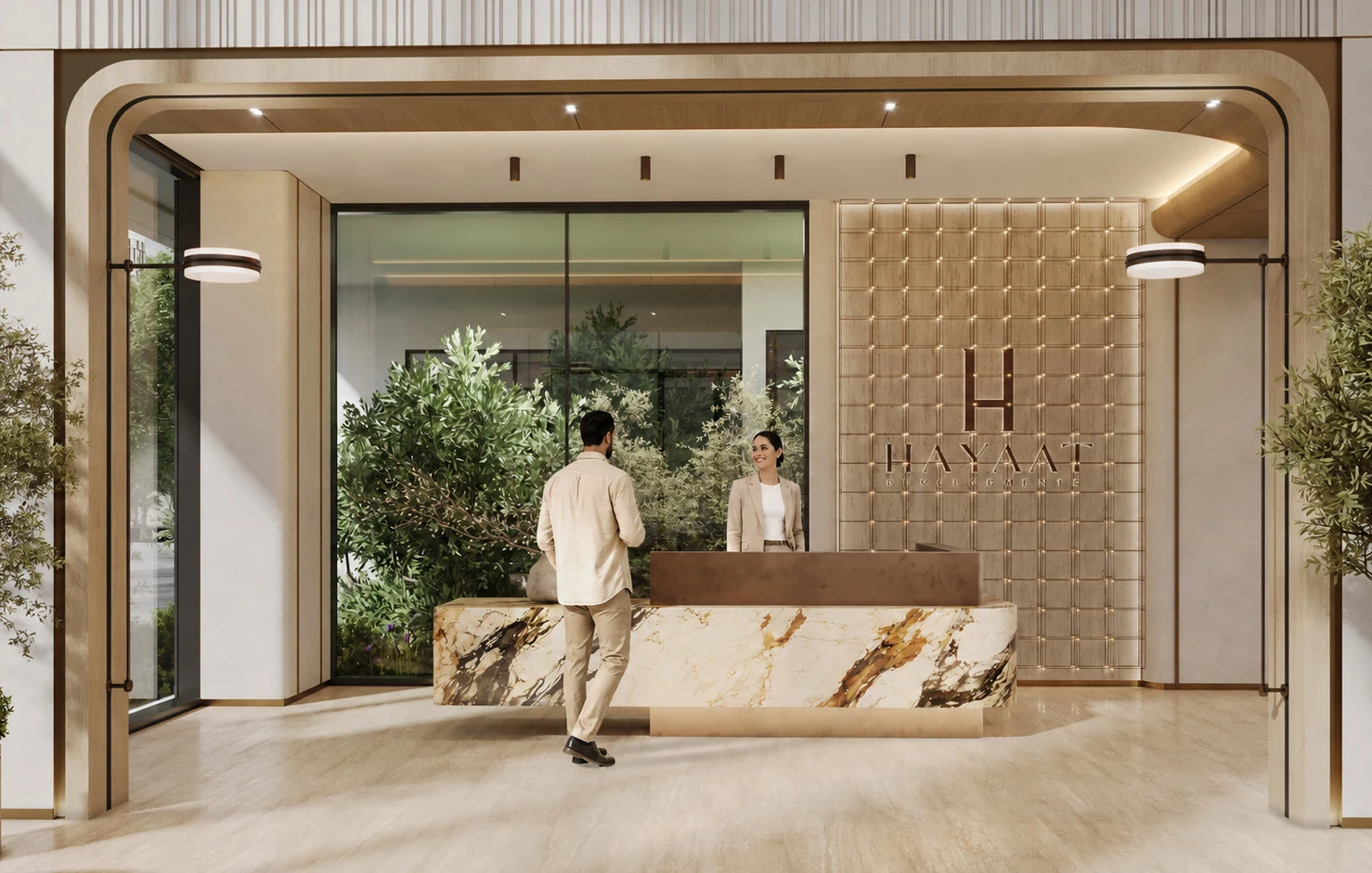 Reception at Isolana with a marble desk, backlit Hayaat panel wall and planted courtyard beyond